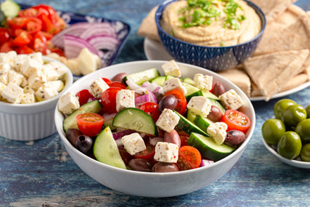 A Bowl of Fresh Greek Salad with Cucumbers Tomatoes Olives and Feta Cheese
