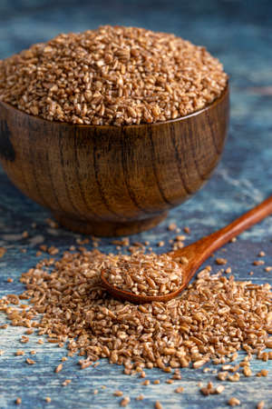 Bowl Bulgur Wheat on a Rustic Blue Table