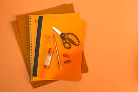 Orange Background of School and Office Suppliesの写真素材