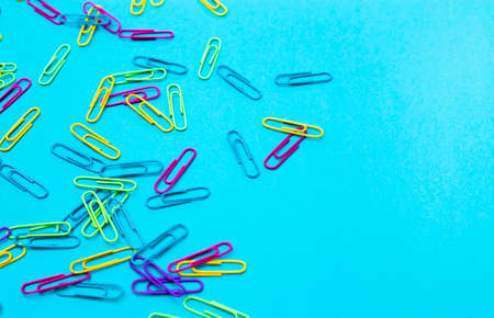 Rainbow Paperclips on a Blue Backgroundの写真素材