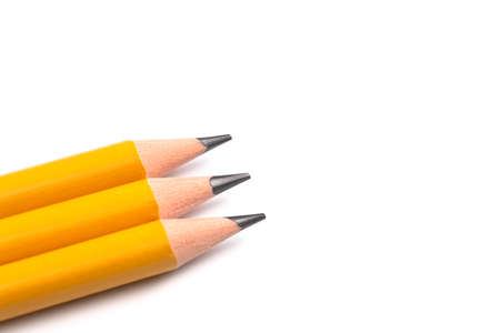 Three Chunky Yellow Pencils for Learning to Write on a White Backgroundの写真素材