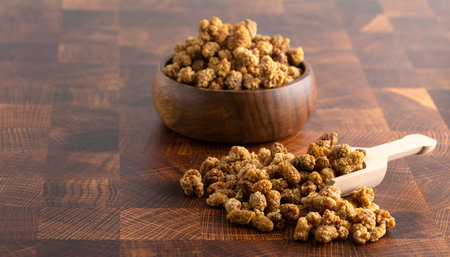 Dried Mulberries on Wooden Butchers Blockの写真素材
