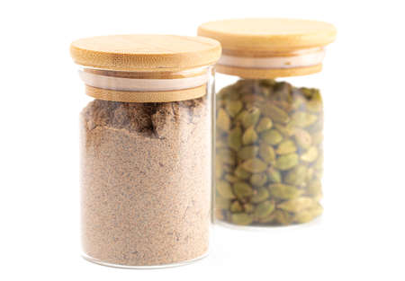 Spice Jars with Cardamom Powder and Green Cardamon Podsの写真素材
