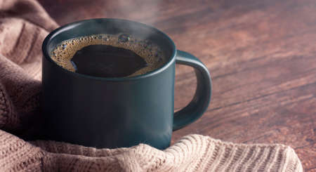 A Cup of Hot Coffee and a Warm Blanket for a Cold Winter Morningの写真素材