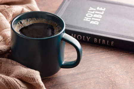A Cup of Hot Coffee and a Bible for Cold Winter Morningの写真素材