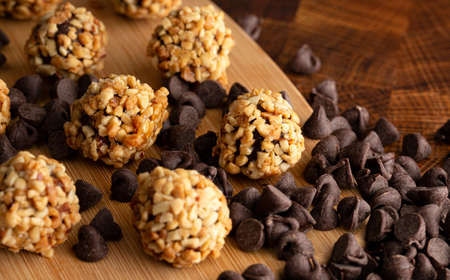 Chocolate Peanut Butter Energy Balls on Wooden Butcher Block