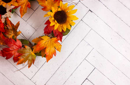 An Autumn Wreath on a White Wooden Wallの写真素材