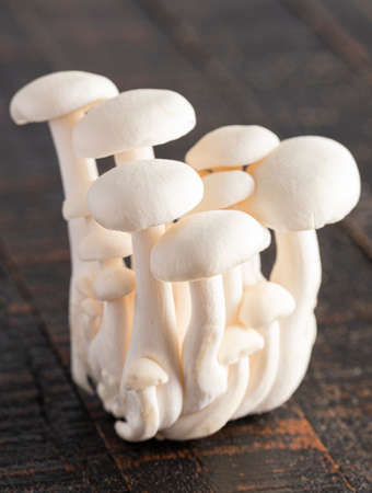 Fresh White Button Mushrooms on a Rustic Wooden Table