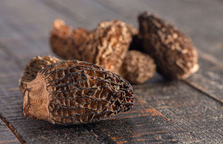 Morel Mushrooms on a Dark Wooden Table