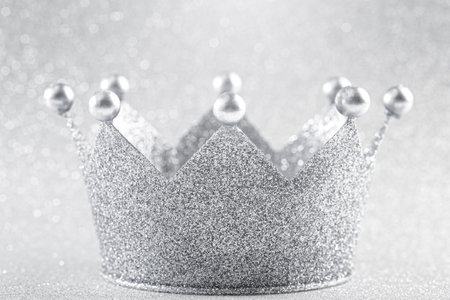 Classic Silver Crown on a Glittery Silver Backgroundの写真素材
