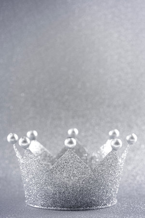 Classic Silver Crown on a Glittery Silver Backgroundの写真素材
