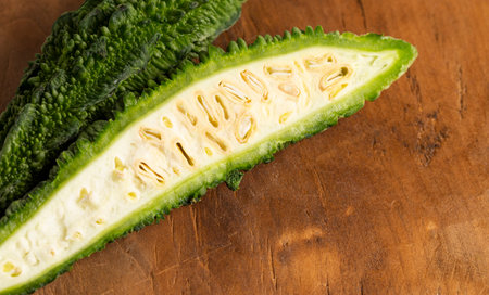 Green Bitter Gourd Melon on a Wooden Tableの写真素材