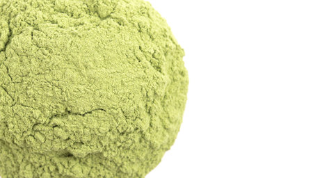 Bowl of Green Kale Powder Isolated on a White Backgroundの写真素材
