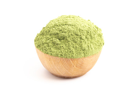 Bowl of Green Kale Powder Isolated on a White Backgroundの写真素材