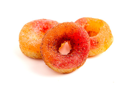 Gummy Fruit Rings Covered in Chili Lime Seasoning on a White Background