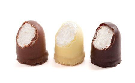 Chocolate Covered Marhsmallow with a Waffer Base Known as Chocolate Kisses or Schokokuss Isolated on a White Backgroundの写真素材