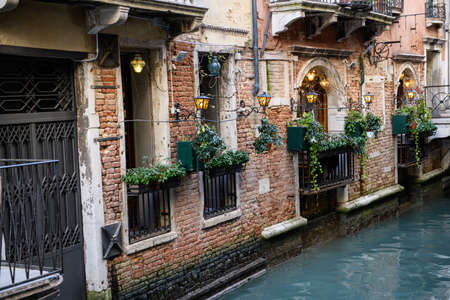 A beautiful facade at a small waterway in the historic center of Venice.の写真素材