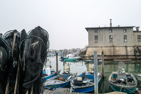 Some small fishing boats in an old fishing port.の写真素材