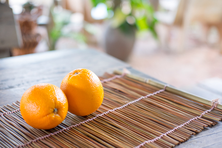 Orange on wood texture background with space for text. Organic Fruitの写真素材