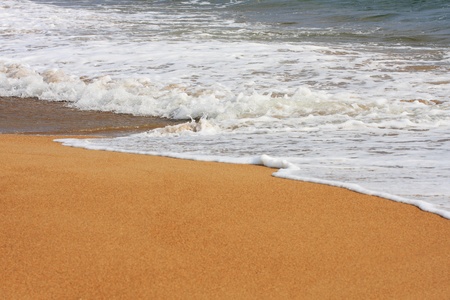 Wave on a sandy beachの写真素材