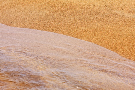 Wave on a sandy beachの写真素材