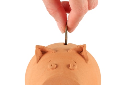 Piggy bank being loadedの写真素材