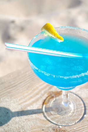 Blue daiquiri cocktail on beachの写真素材