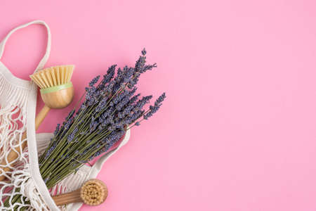 Eco-friendly kitchen accessories on pink background. The concept zero waste and our planet.の写真素材