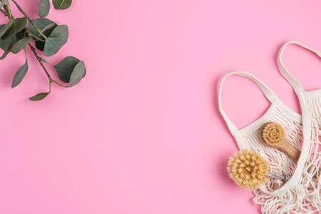 Eco-friendly kitchen accessories on pink background. The concept zero waste and our planet.の写真素材