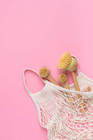 Eco-friendly kitchen accessories on pink background. The concept zero waste and our planet.の写真素材