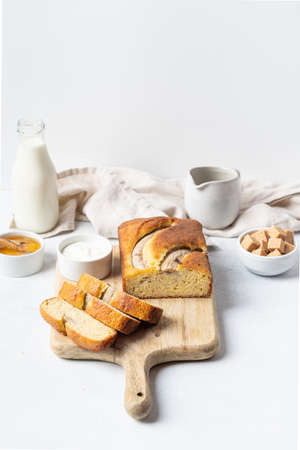 Crispy banana bread with cinnamon on a gray concrete background. Dessert.の写真素材