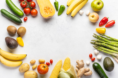 Gastronomic frame made of fresh vegetables and fruits . Top view, place inscriptionの写真素材