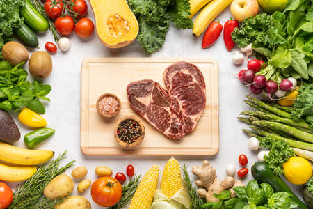 Frame of healthy protein sources and body building food : fish, vegetables, legumes, nuts, meat and dairy products on a light slate. Top view, copy spaceの写真素材