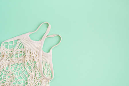 Eco bag on turquoise paper backgroundの写真素材