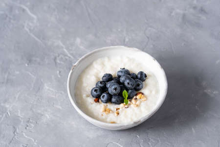 Rice porridge on coconut milk with blueberries. Healthy breakfast, healthy foodの写真素材
