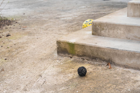 Two balls abandoned on worn concrete steps. High quality photoの写真素材