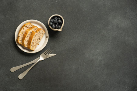 Rustic breakfast with toast on dark background.