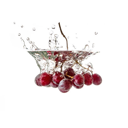 Grapes on water splash, isolated on white backgroundの写真素材