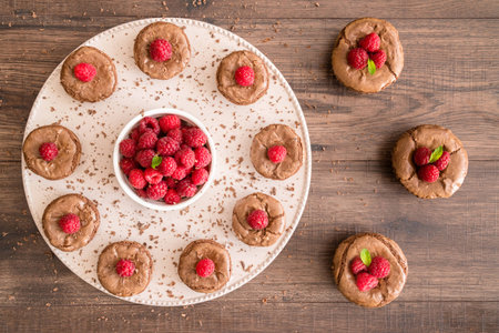 Chocolate lava cakes with fresh raspberries and mint, roundの写真素材