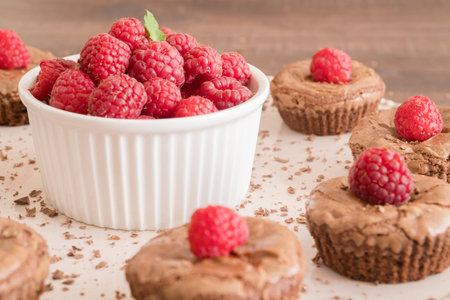 Chocolate lava cakes with fresh raspberries and mintの写真素材