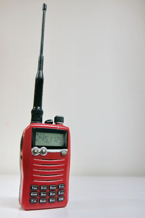 red walkie talkie radio on the white backgroundの写真素材