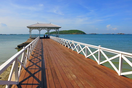 a wooden bridge to the sea