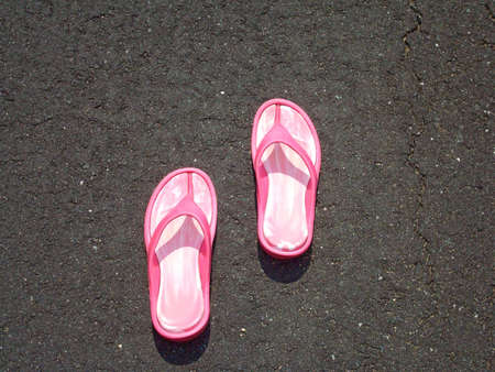 Pink Flip Flops On Pavement