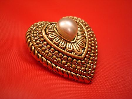 Gold Heart With Pearl On Redの写真素材
