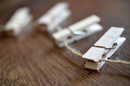 An image of four clothespins on a string.