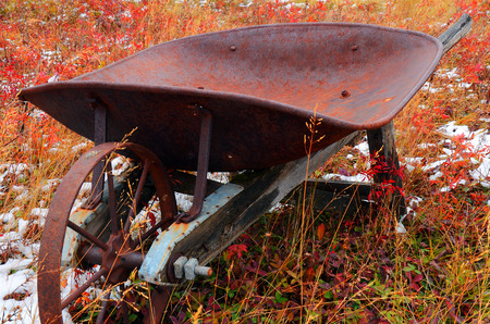 An image of an old vintage wheel barrow.の写真素材