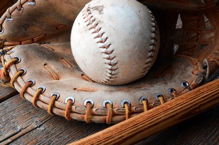 A close up image of old used baseball equipment.