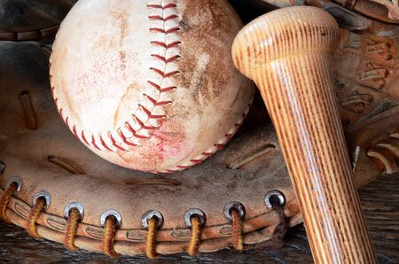 A close up image of old, used, and dirty baseball equipment.の写真素材