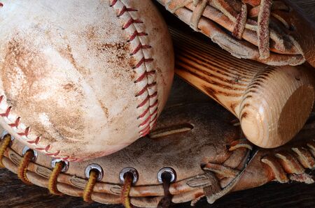 A close up image of old, used, and dirty baseball equipment.の写真素材