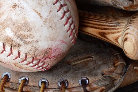 A close up image of old, used, and dirty baseball equipment.の写真素材